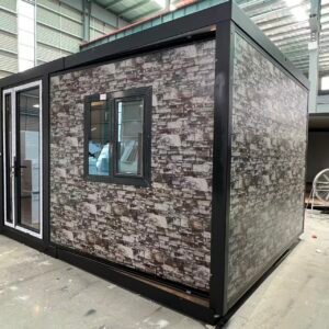 Side view of a 10FT camouflage expandable container home with insulated wall panels and flat roof