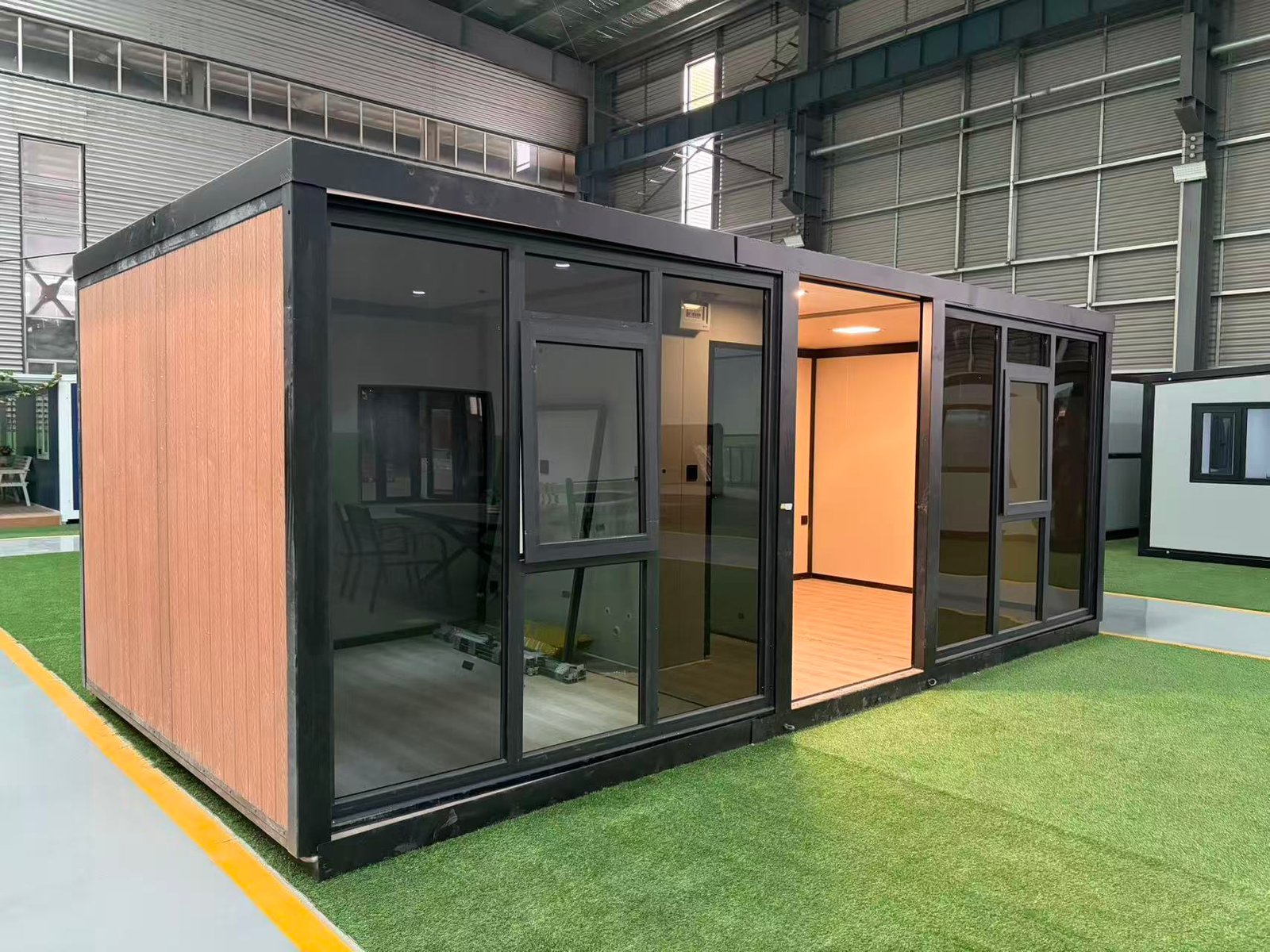 Side view of 10FT flat roof glass expandable container house with modern curtain wall design