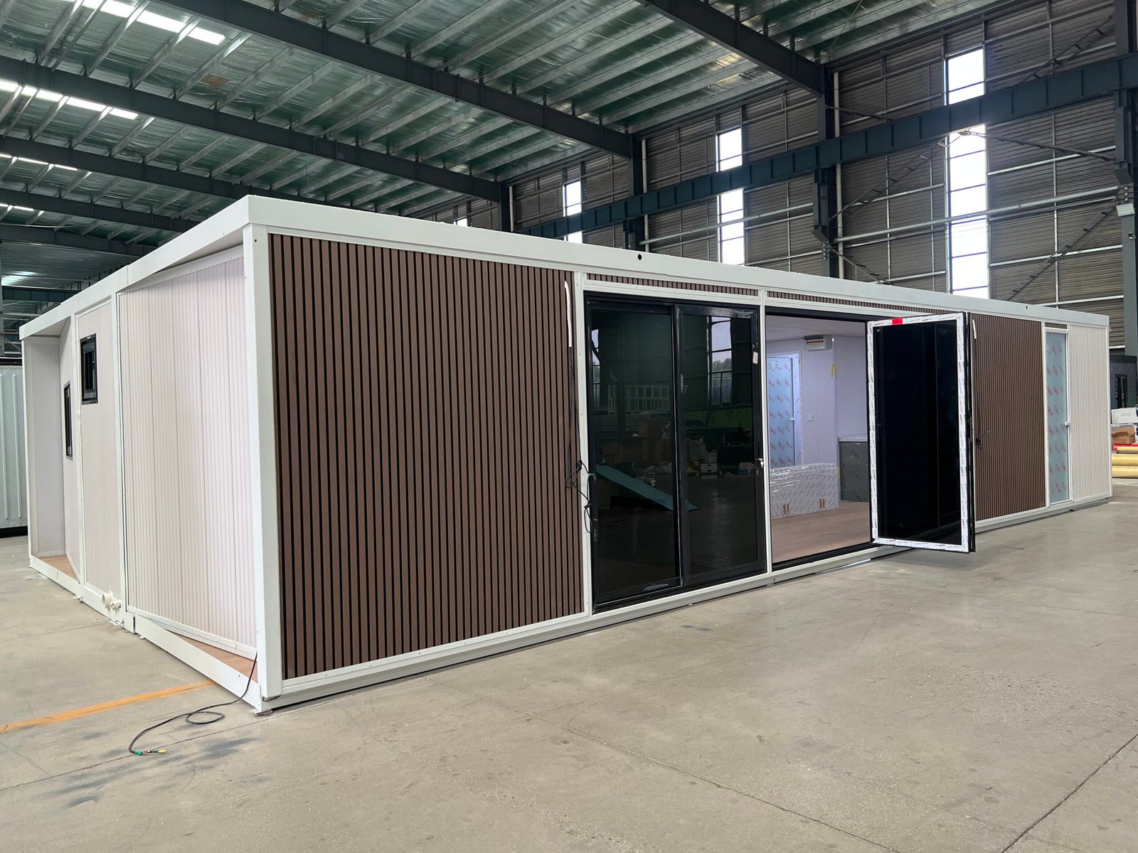 Side view of a 40FT expandable container home with large windows for increased natural light