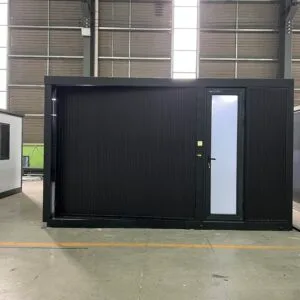 Front view of a black single-wing expandable container house with modern exterior design