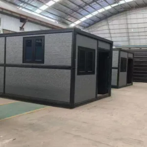Flat pack container house with black steel frame and insulated wall panels