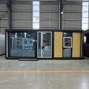Front view of a flat roof expandable container house with a half-width floor-to-ceiling window facade
