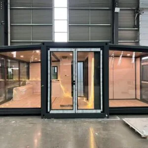 Front view of a prefab sunroom with two glass walls and integrated LED strip lighting