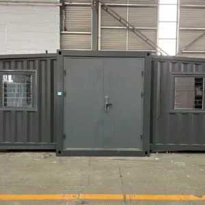 Front view of a gray hurricane-resistant expandable container house designed for coastal and island environments