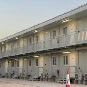 Multi-room prefab container building with exterior walkway