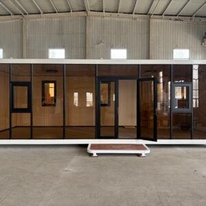 11.8m apple capsule house prefab modular container house, factory workshop front view with large tinted glass wall