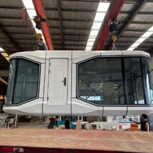 23sqm compact Space Capsule House, small luxury glamping pod being lifted inside manufacturing workshop