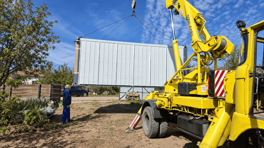 Expandable container house dealer transporting a finished unit for local customer delivery